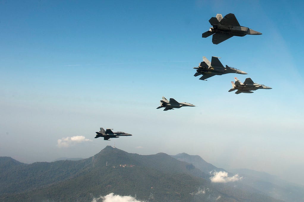 F-15 Eagle’s from the 104th Fighter Wing, Massachusetts Air National Guard, train with U.S. Air Force F-22 Raptors and members of the Royal Malaysian Air Force in Malaysia