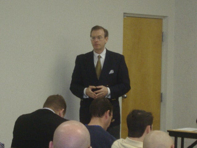 Joe Arminio doing a seminar on his economic and world views.