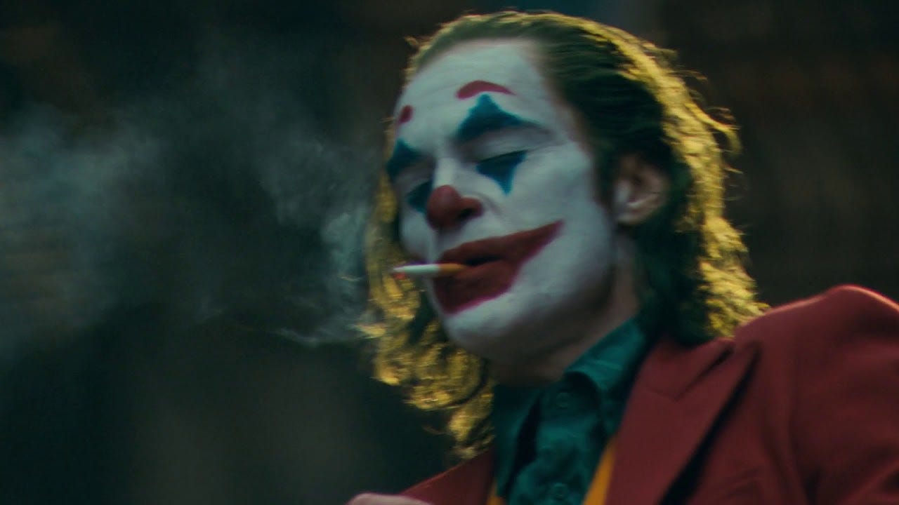 An image from the Joker movie with the Joker smoking a cigarette