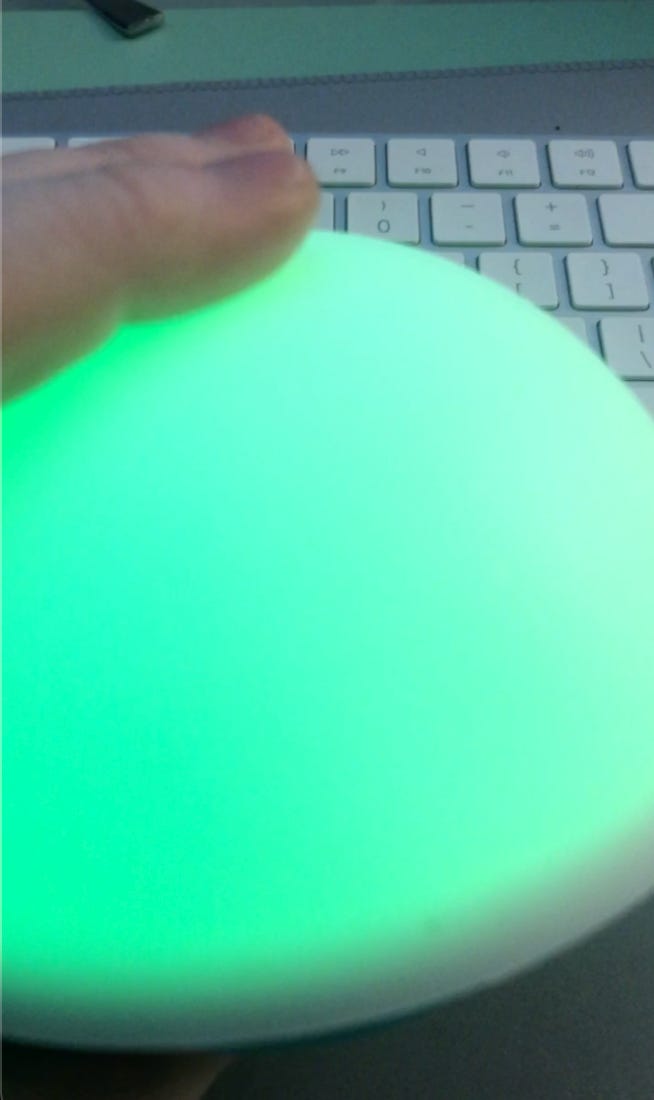 A bright greenish light, soft an squishy with fingers poised