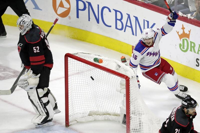 New York Rangers center Ryan Strome (16) celebrates his goal in front of Carolina Hurricanes right wing Nino Niederreiter (21) during the second period of Game 7 of an NHL hockey Stanley Cup second-round playoff series Monday, May 30, 2022, in Raleigh, N.C. (AP Photo/Chris Seward)