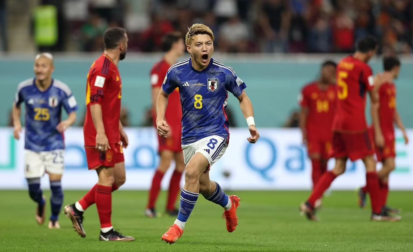 Japan stun Spain but both reach World Cup last 16