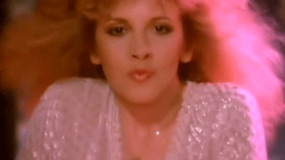 A GIF of Stevie Nicks dancing from her music video for "Gypsy."