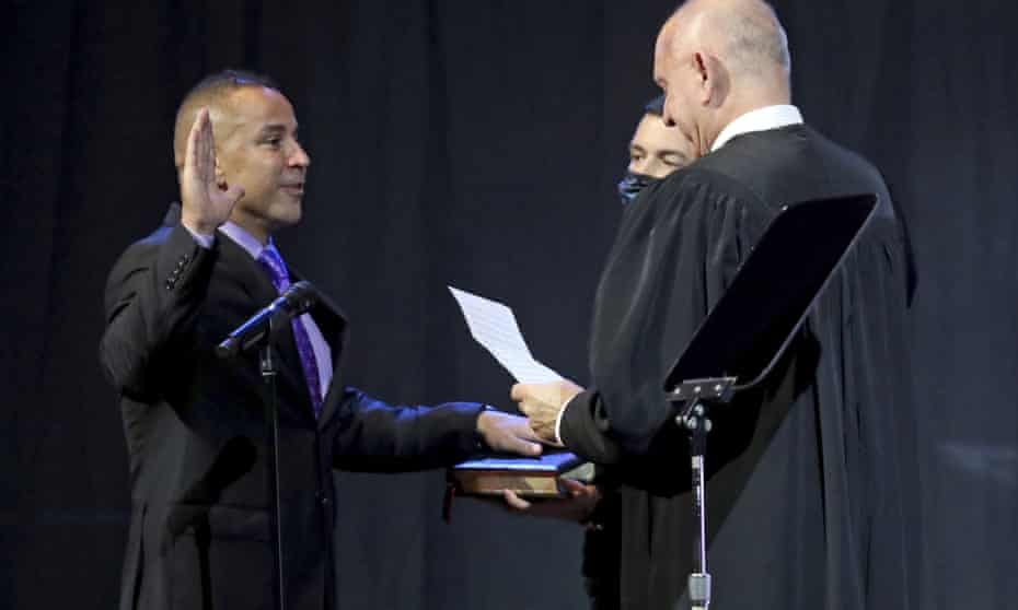 Larry Scirotto is sworn in as the new chief of the Fort Lauderdale Police Department by Chief Judge Jack Tuter at First Baptist Fort Lauderdale on Tuesday, Aug. 24, 2021, in Fort Lauderdale, Fla. Scirotto was fired by City Manager Chris Lagerbloom on Thursday, March 3, 2022. The complaints centered on allegations that Scirotto made hiring and promotion decisions with an improper minority-first approach. (Amy Beth Bennett/South Florida Sun-Sentinel via AP, File)