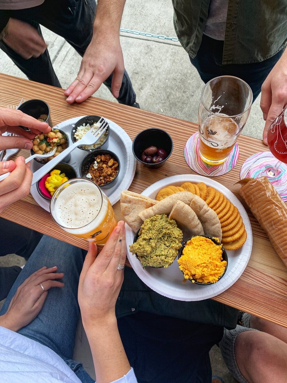 Snacks are better with friends. Full spread at Grimm from the Samesa kitchen - pistachio lentil dip and beer cheese are forever a required order - ask for extra Ritz.