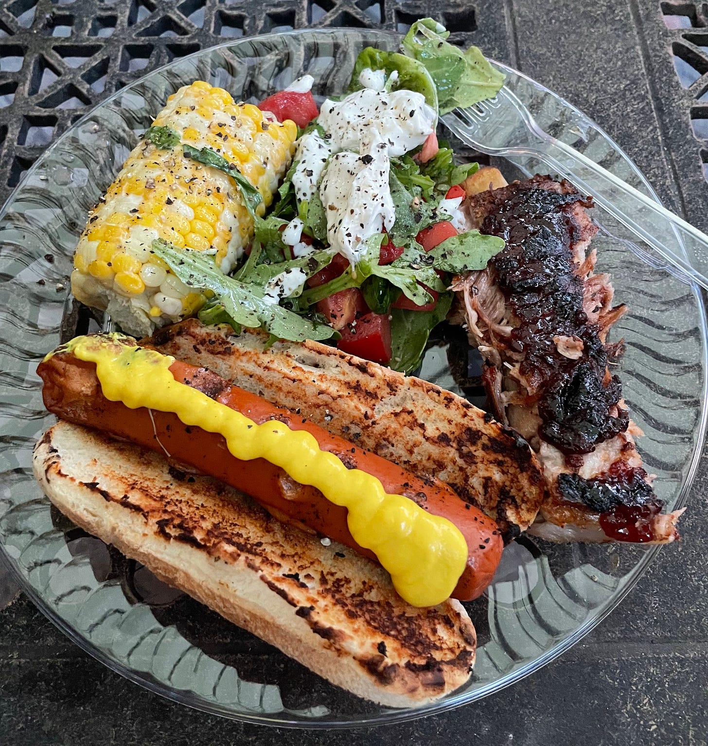 BBQ night: veggie dog, spare ribs, burrata-adorned salad, grilled corn