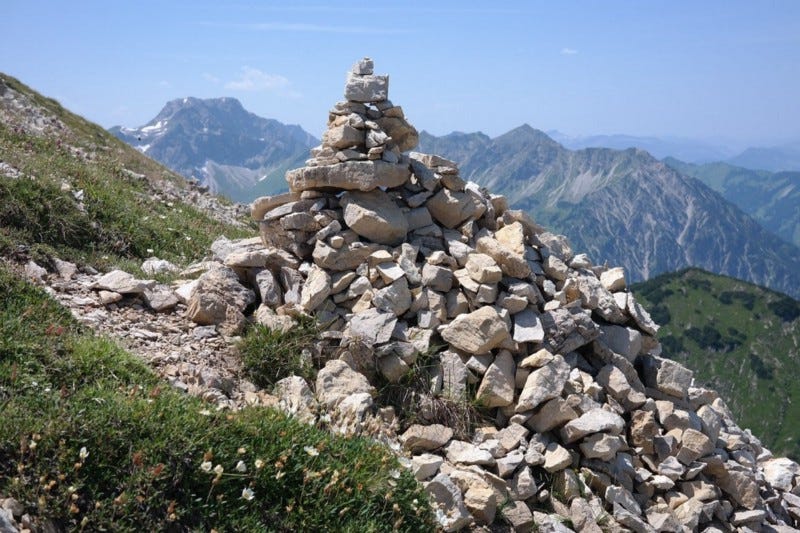 Stone cairn in mountains.