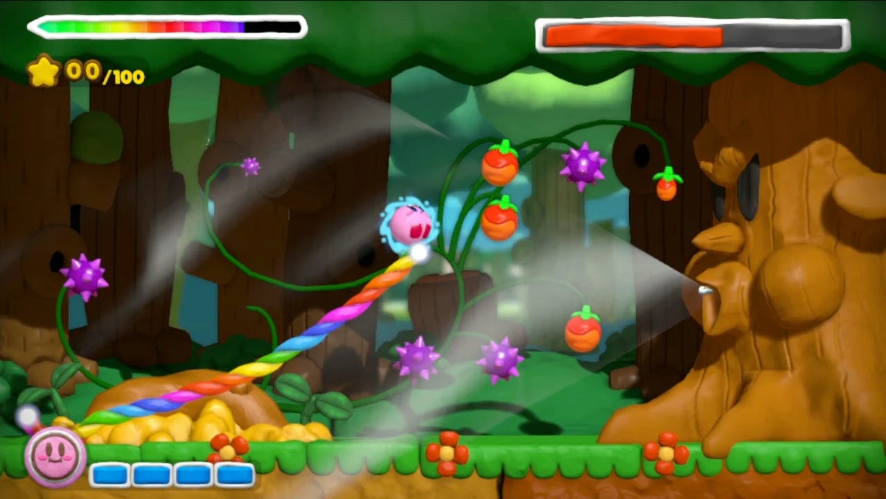 A screenshot of the boss fight against Whispy Woods, meant to show off the clay-based art style of Rainbow Curse.