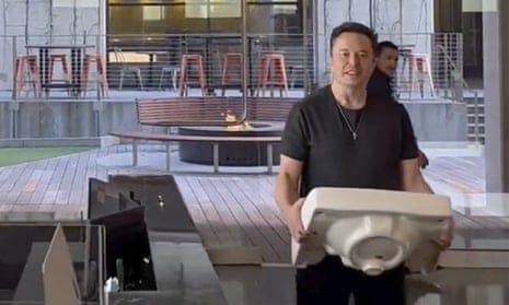 Elon Musk makes splashy visit to Twitter headquarters carrying sink | Elon  Musk | The Guardian