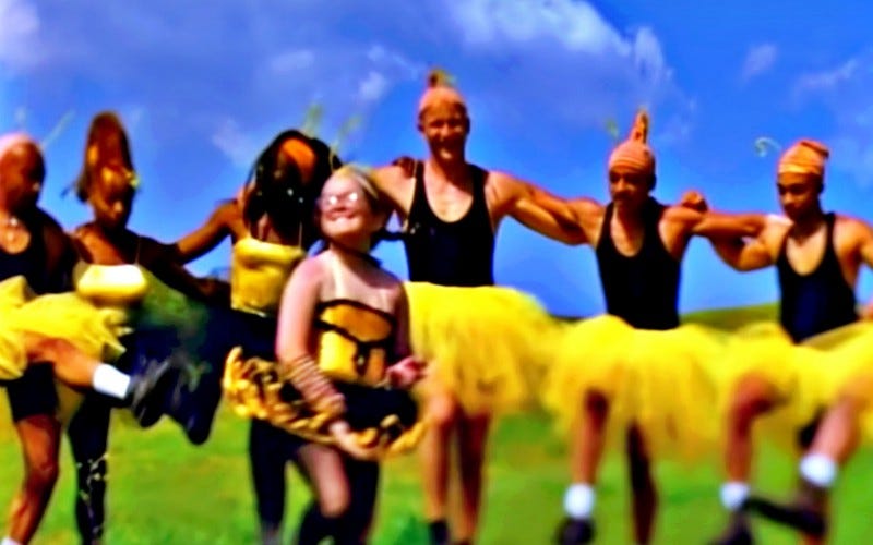 Girl in bee costume dances among adult strangers in the same costumes.