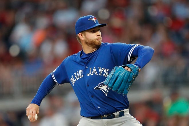 Toronto Blue Jays pitcher T.J. Zeuch works against the Atlanta Braves during the second inning of a baseball game Tuesday, Sept. 3, 2019, in Atlanta.