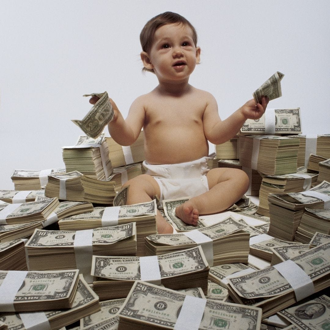 The millionaire baby sitting on a pile of a million bucks!