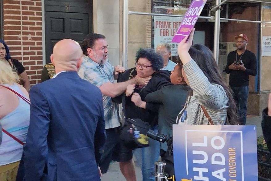 A female protestor at a Gov. Kathy Hochul rally was choked by a man.