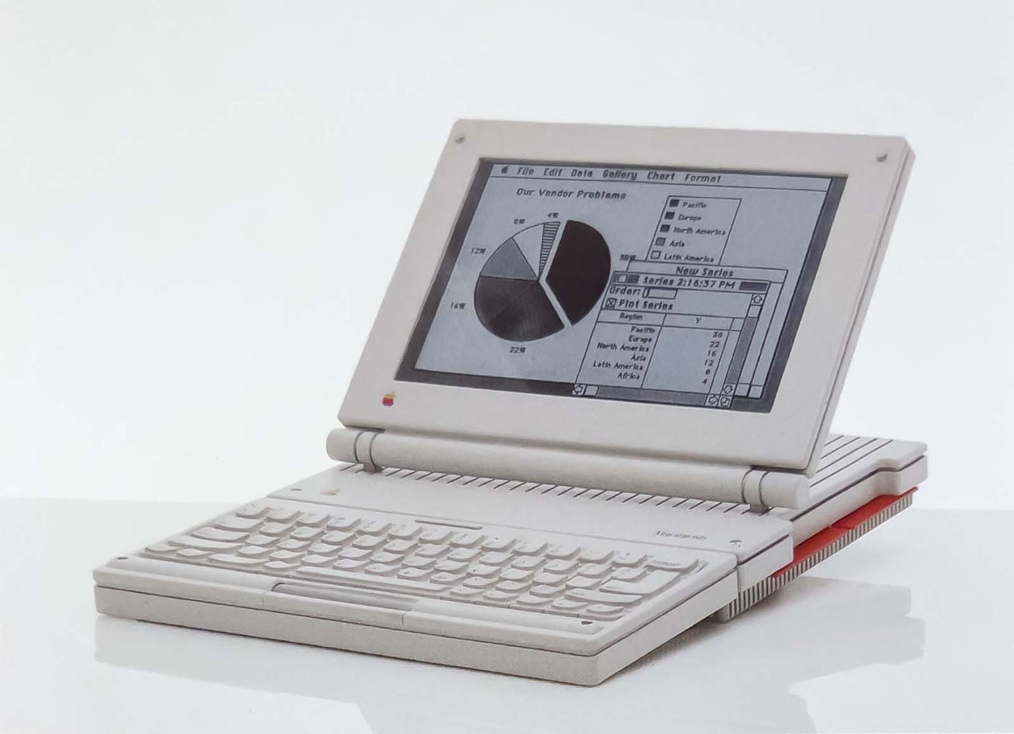 A prototype design for a portable Mac, with folding LCD screen and bright red accent