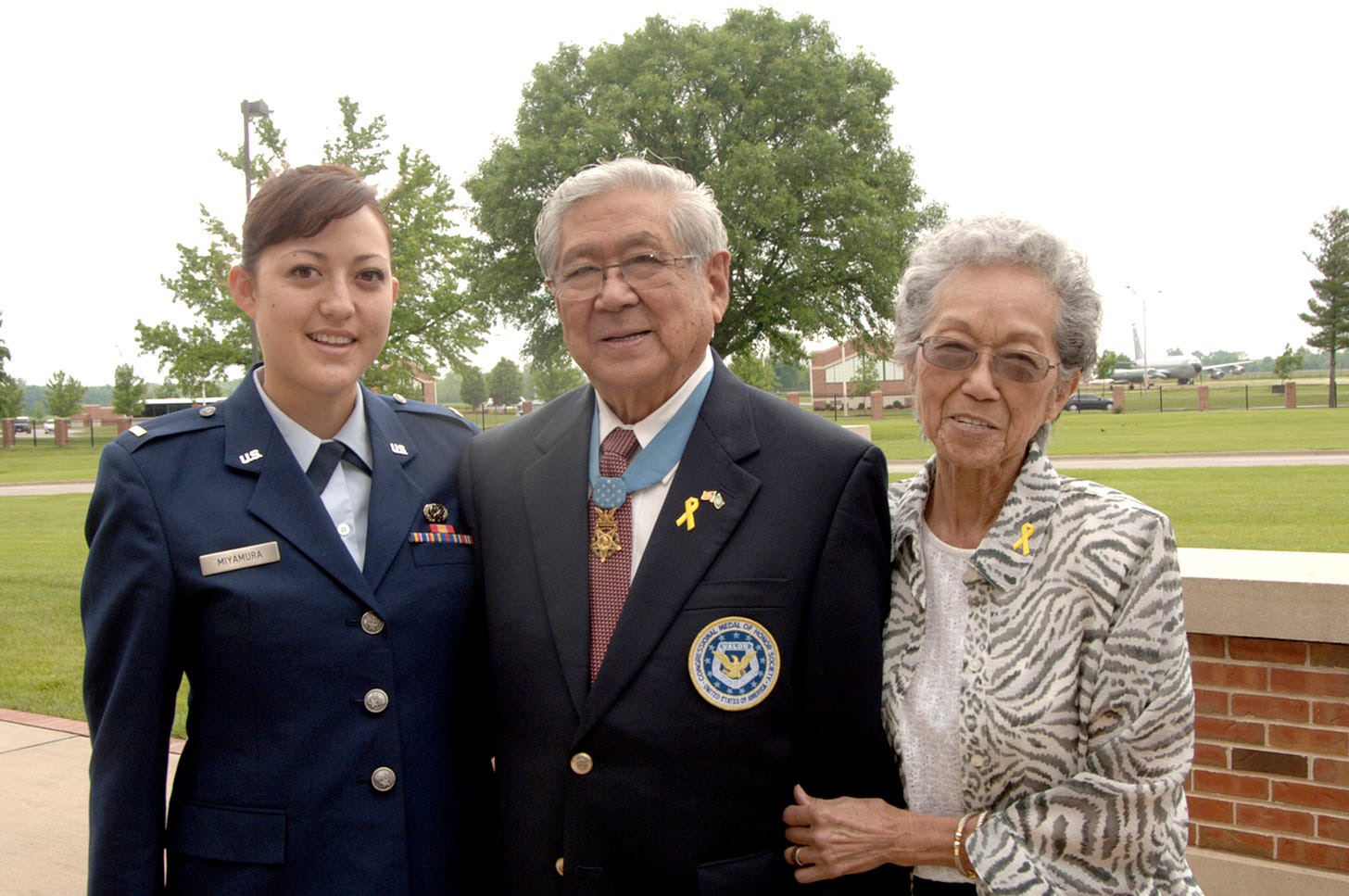 Miyamura with his wife and granddaughter, an officer in the United States Air Force.