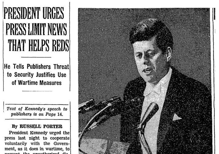 May be an image of 1 person and text that says 'PRESIDENT URGES PRESS LIMIT NEWS THAT HELPS REDS He Tells Publishers Threat to Security Justifies Use of Wartime Measures Text of Kennedy's speech to publishers is on Page 14. By RUSSELL PORTER President Kennedy urged the press last night to cooperate voluntarily with the Govern- ment, as it does in wartime, to'