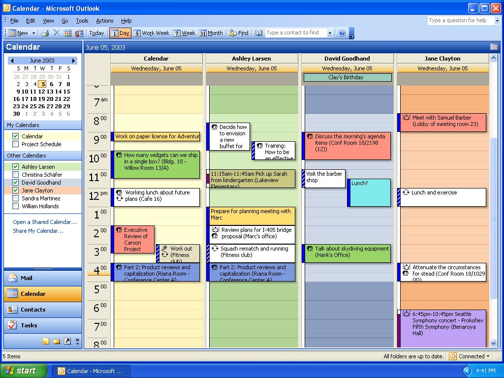 Screen shot of Outlook showing 4 different user's calendars open.