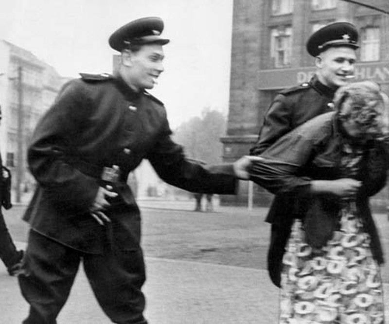Soviet soldiers openly sexually harass a German woman in Leipzig, 1945 ...