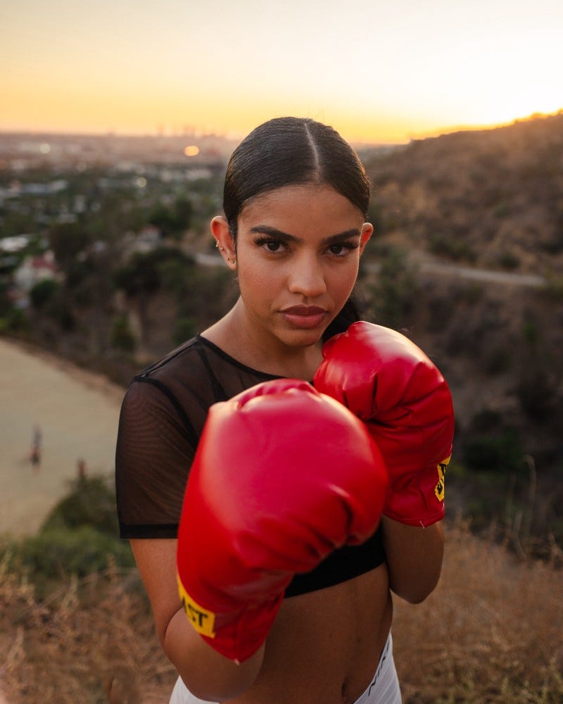 a girl in boxing gloves