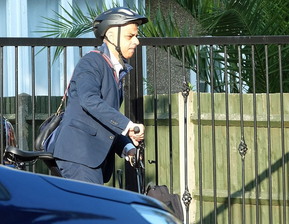 Sadiq Khan tried to burnish his green credentials today by cycling to work - but was closely followed by a gas-guzzling Range Rover