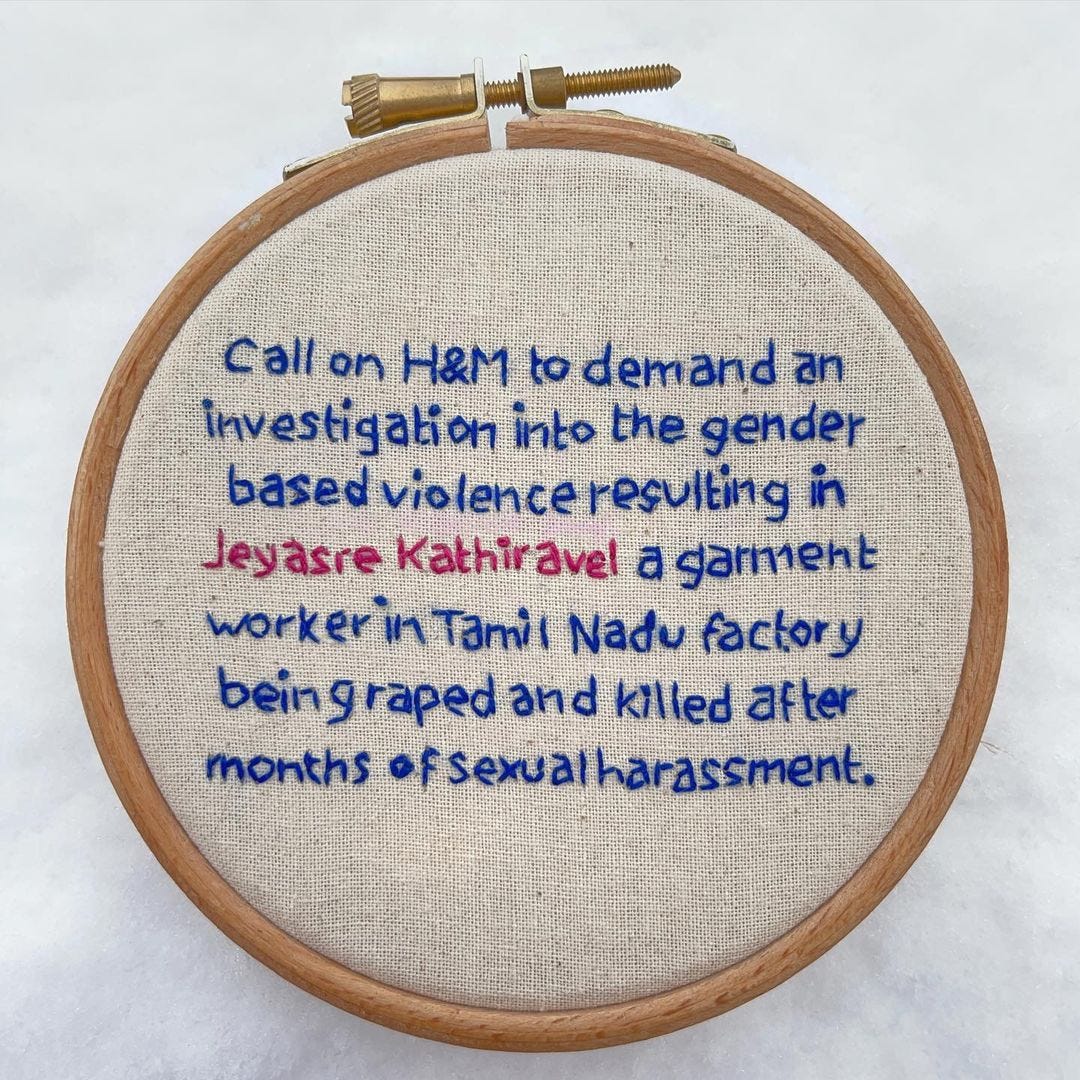 Embroidery hoop text reads “Call on H&M to demand an investigation into the gender based violence of Jeyasre Kathiravel a garment worker in Tamil Nadu factory being raped and killed after months of sexual harassment.”