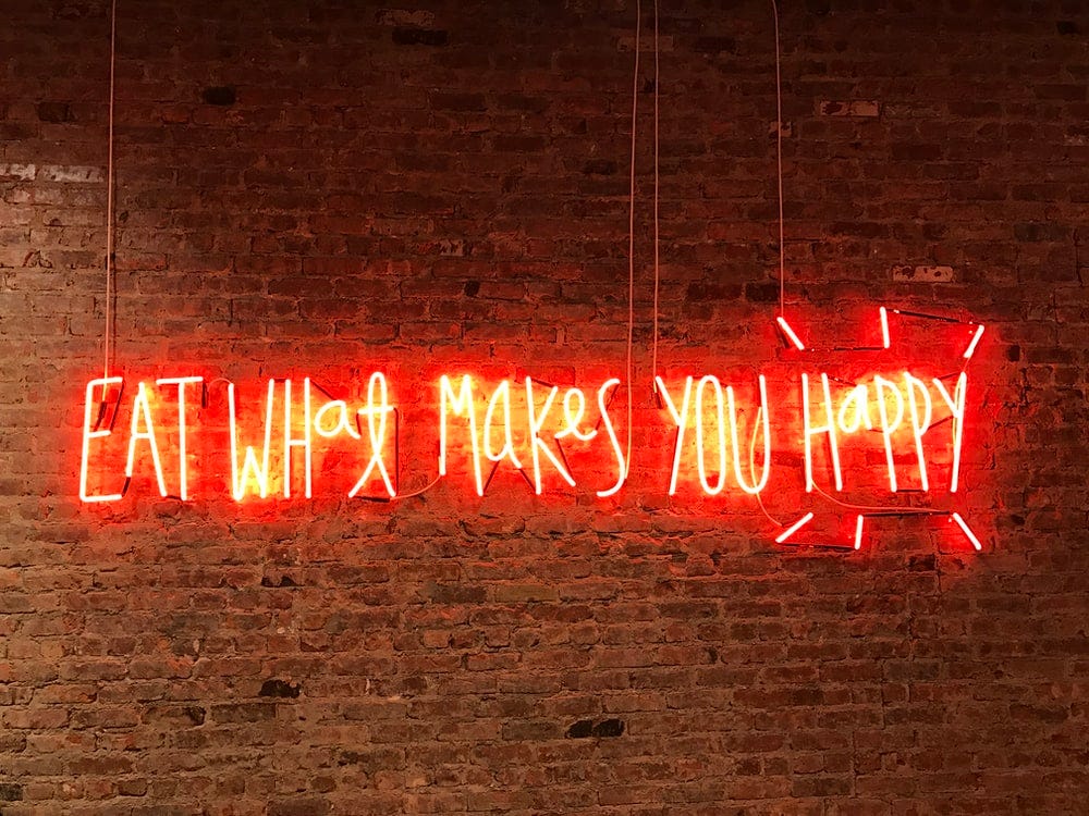 lighted eat what makes you happy neon signage