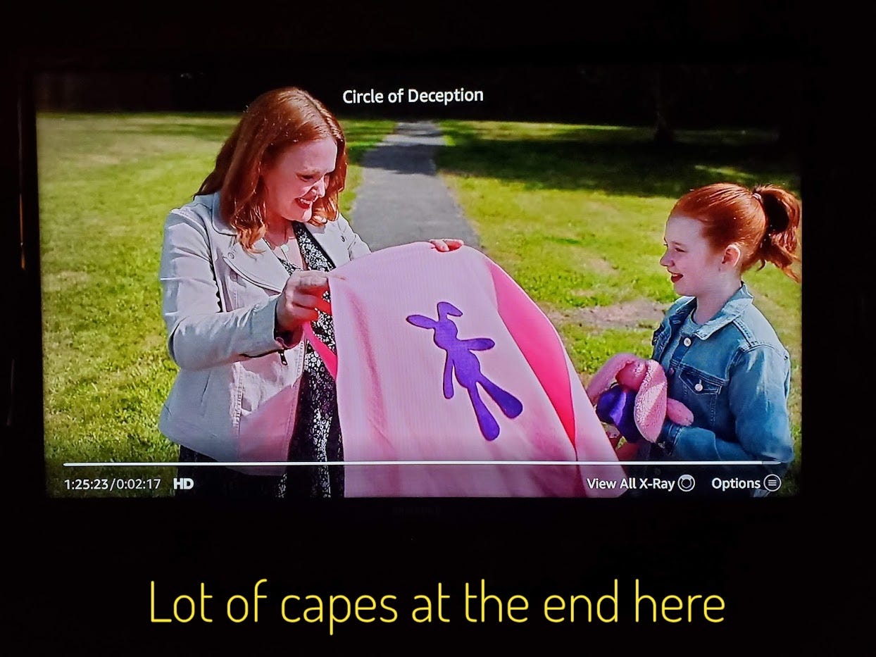 Brenna and Sally with a pink cape with a bunny on it, I don't know, captioned "Lot of capes at the end here"