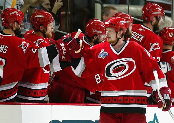 Eric Staal of the Carolina Hurricanes celebrates with teammates after scoring against the Edmonton Oilers during the second period of game five of...