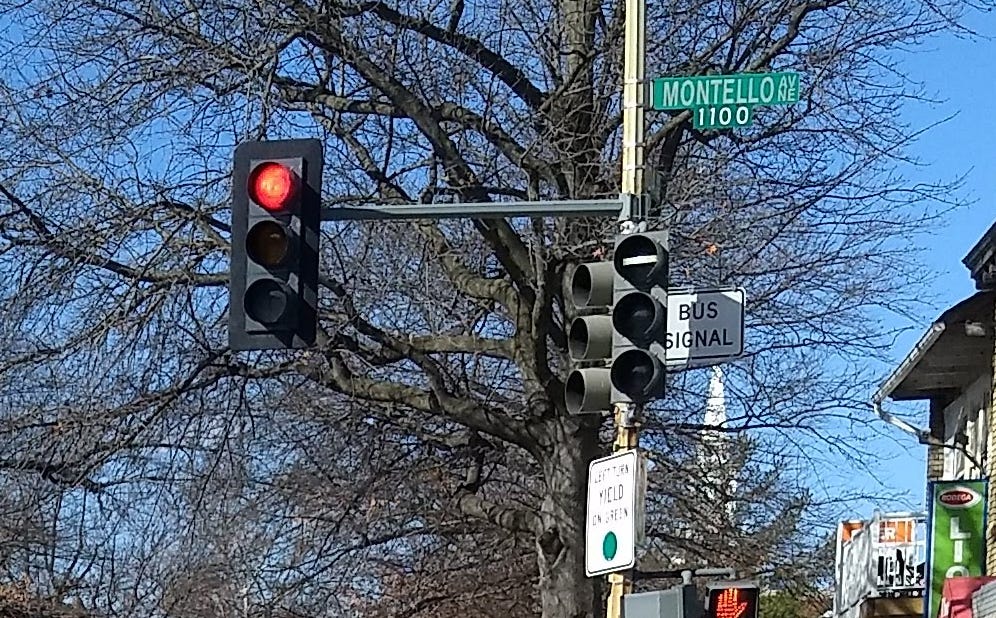 A photo, from Google Streetview, of a traffic light, with an additional signal labeled "BUS SIGNAL"