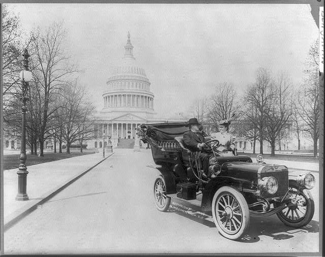 Sen. Benjamin Ryan Tillman & wife, in auto; Capitol in background