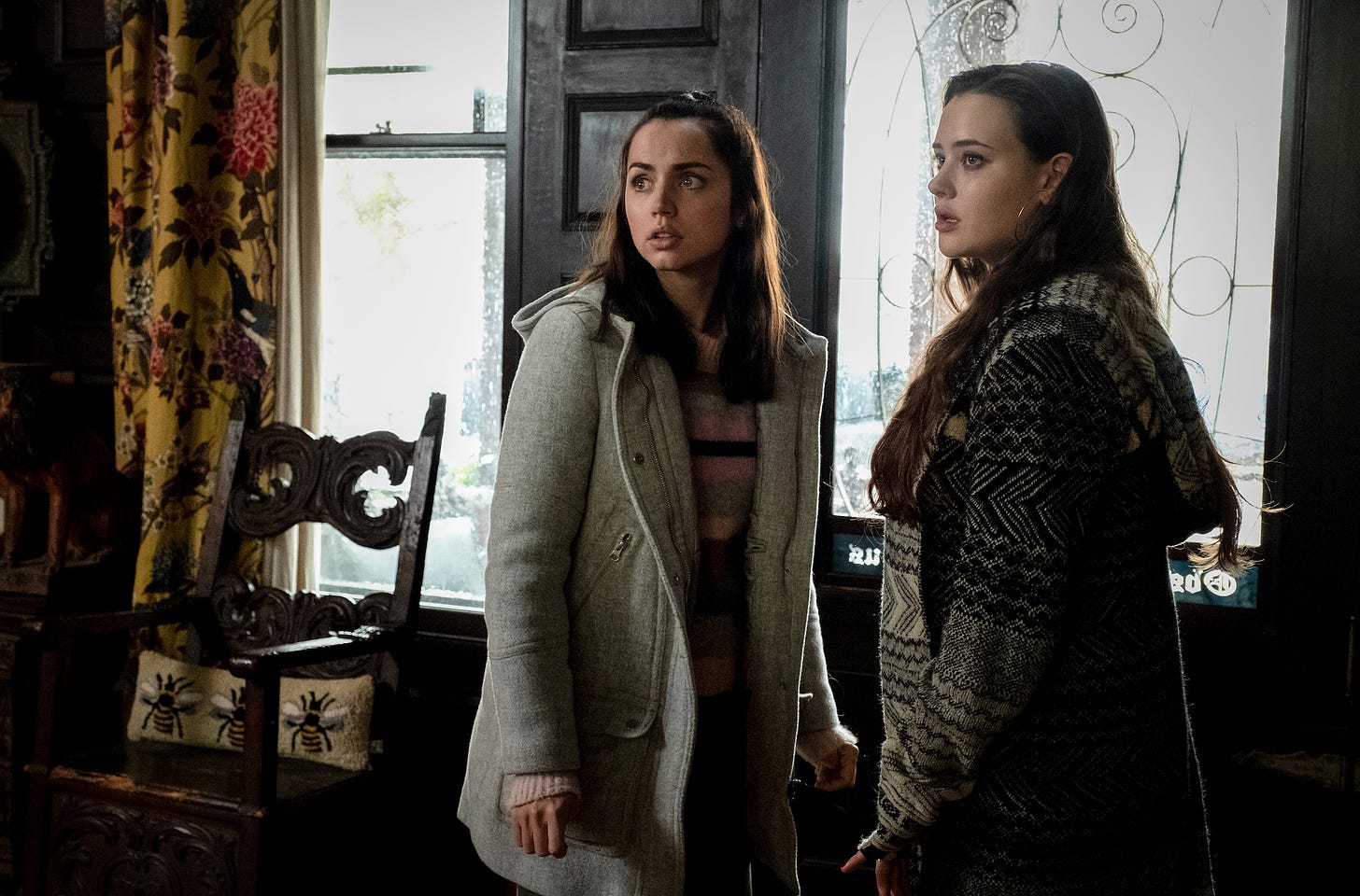 Ana de Armas as Marta Cabrera (left) and Katherine Langford as Meg Thrombey (right) in KNIVES OUT.