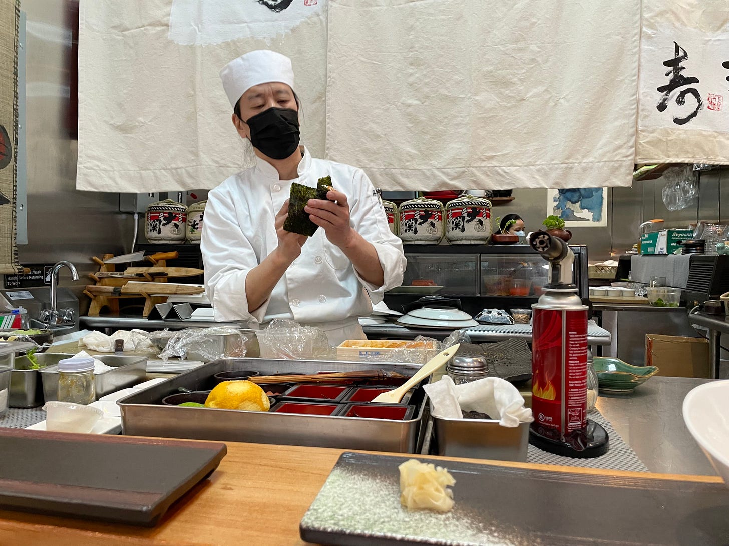 Chef Jiro making an uni hand roll.