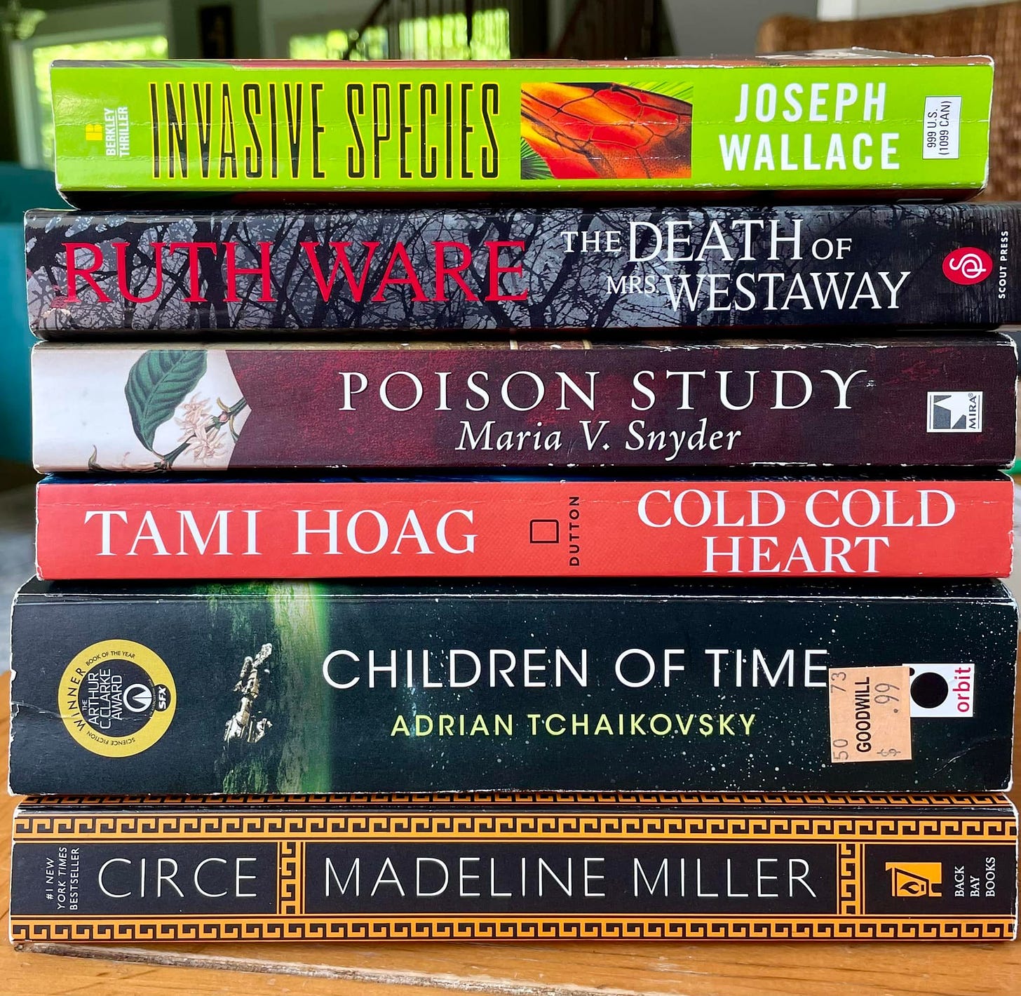 image of book spines; titles are invasive species, death of mrs westaway, poison study, cold cold heart, children of time, circe