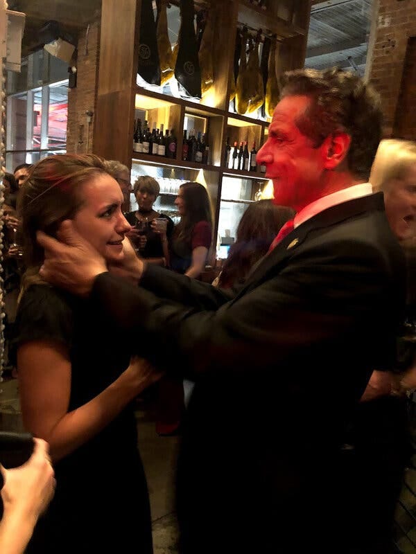 A photo capturing NY Governor Cuomo assaulting a women 