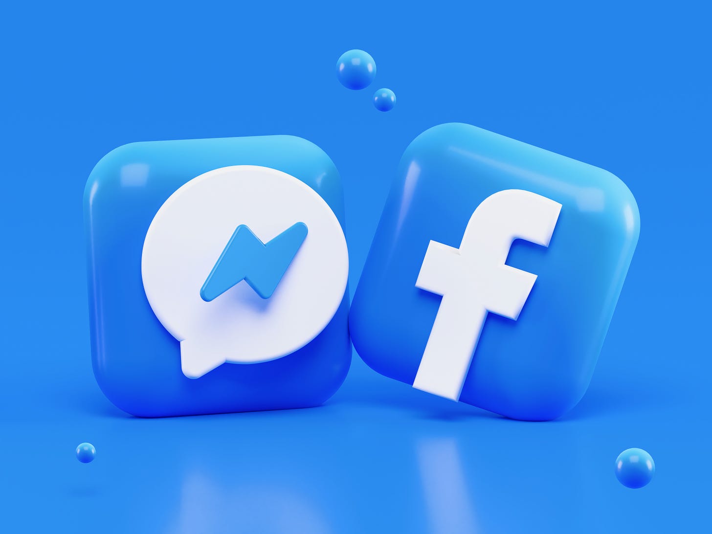 Illustration of the app icons for Messenger and Facebook side by side. Alexander Shatov / Unsplash