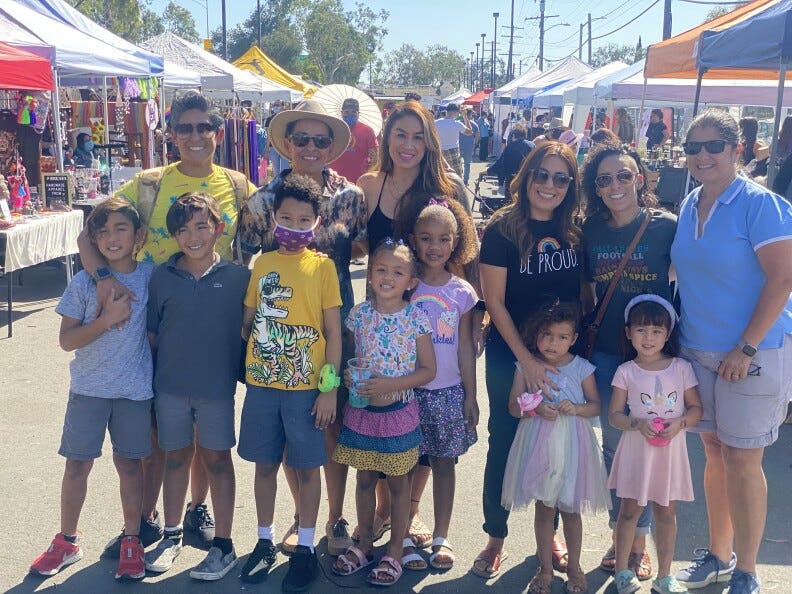 A group of women and their children at the Queer Mercado. 