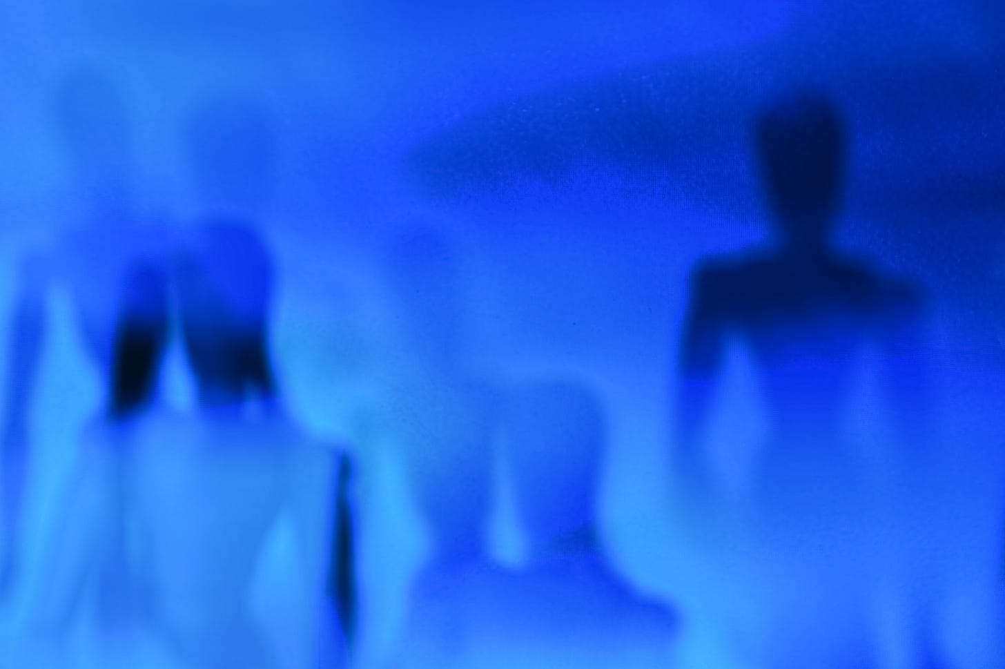 Humanoid shadows in a blue space