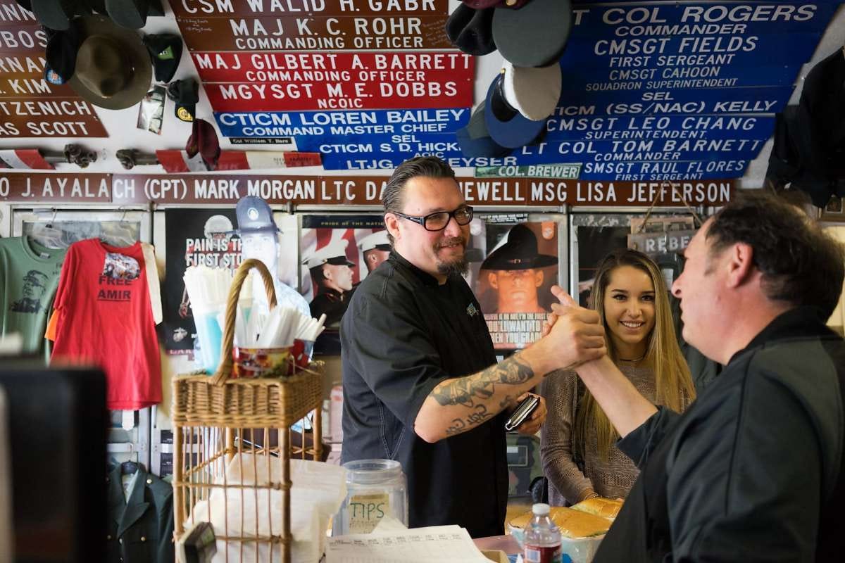 Cy Yontz, left, greets Bennett Compagno at Compagno's Market and Deli in Monterey, Calif. on Monday, Aug. 31, 2015. Cy Yontz was named Monterey's Chef of the Year.