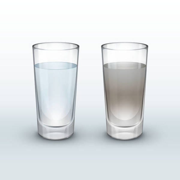 Two glasses of water against a white background. The first is clear. The second is tainted.