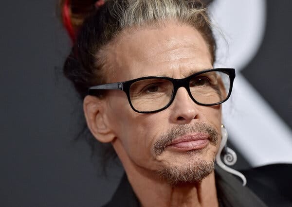 A close-up of Steven Tyler wearing glasses.
