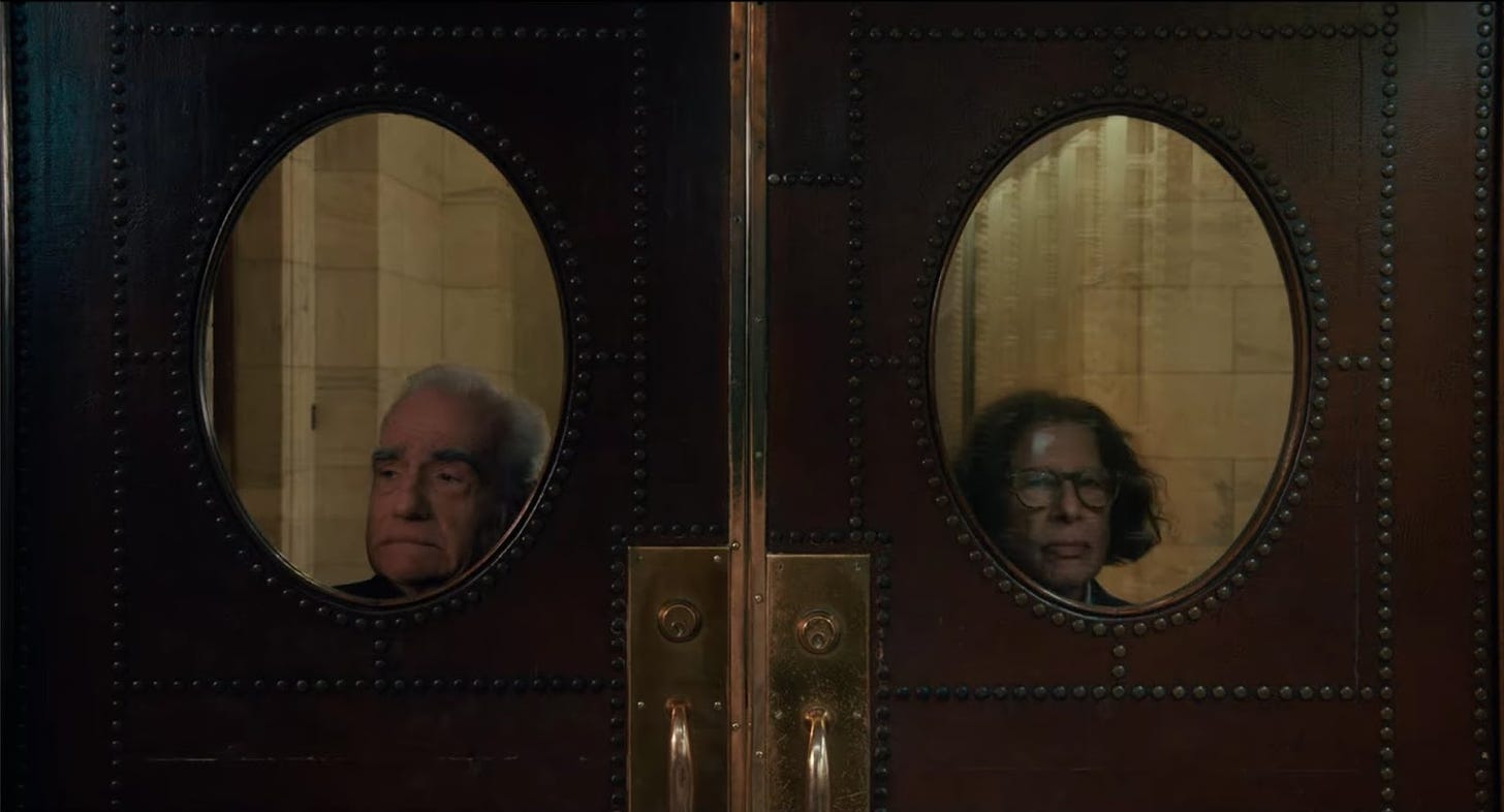 Fran Lebowitz and Martin Scorsese looking through windows