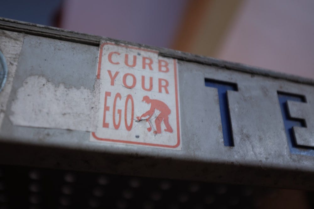Sticker says curb your ego, but dont forget your organizational ego