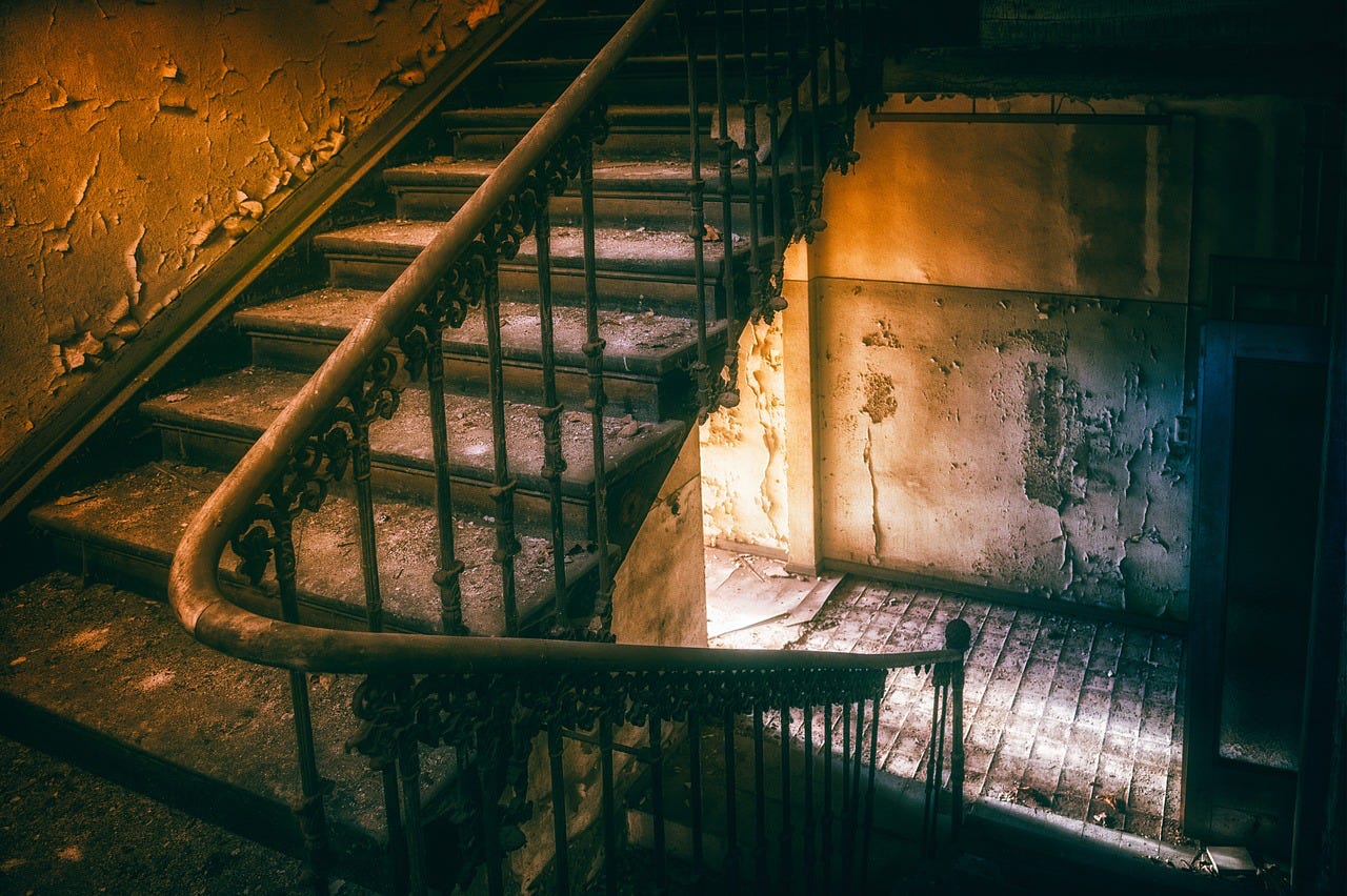 dilapidated stairwell, dark