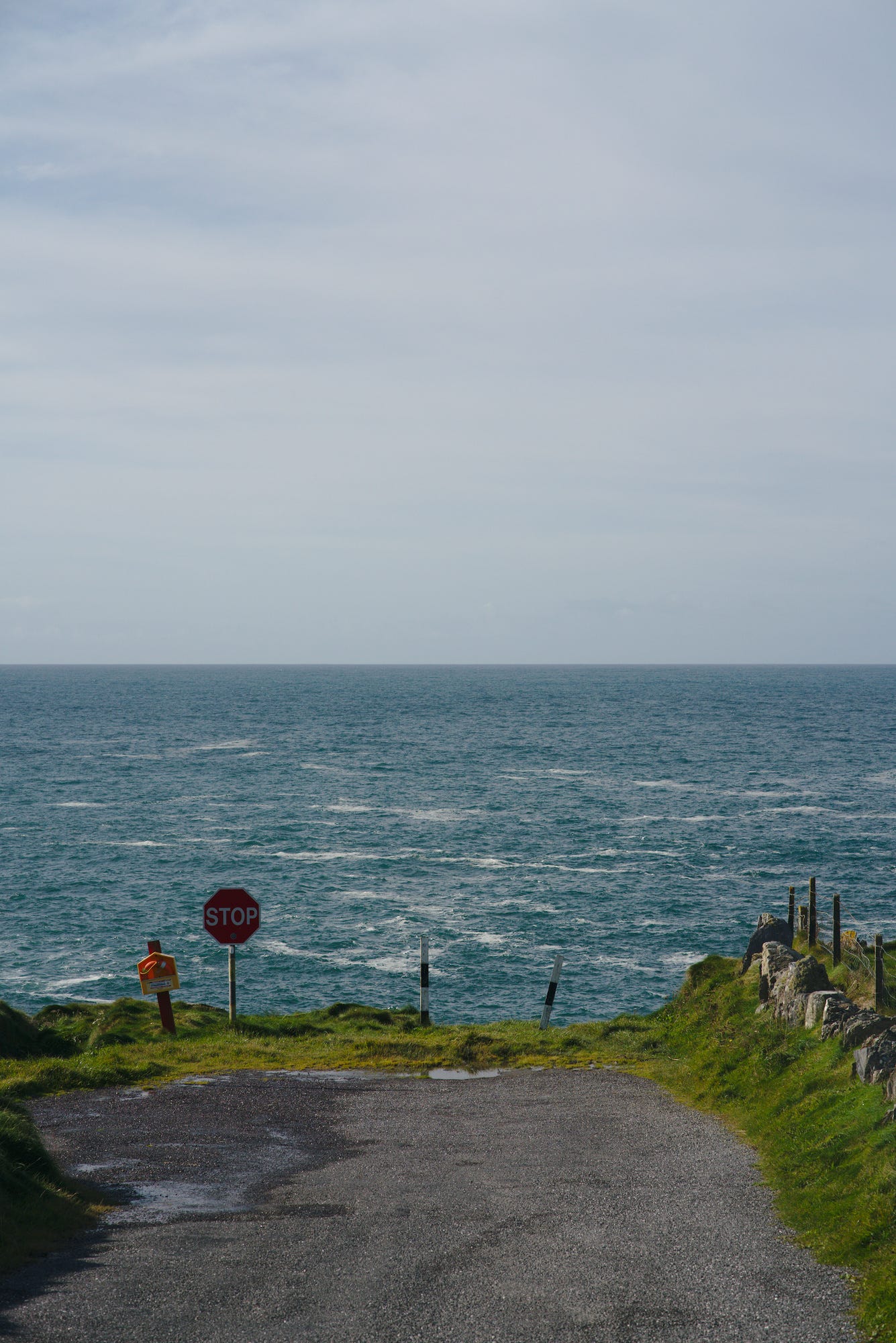 A stop sign that is the only thing stopping cars from plunging into the Atlantic at the end of the Mizen Peninsula in west Cork, Ireland. A suitable feeling metaphor for modern times.