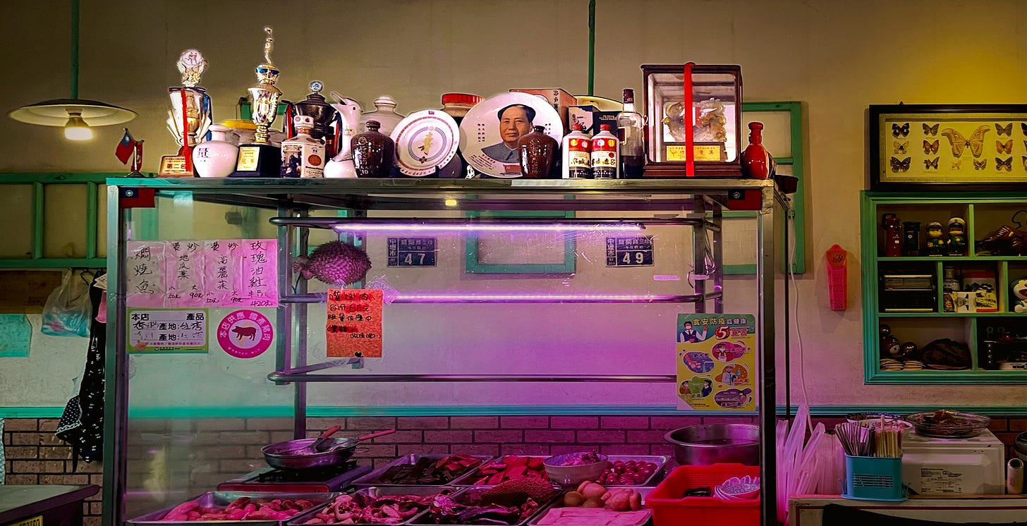 The luwei stand inside Army Diner is decorated with a variety of medals, collectibles, and commemorative Mao plates