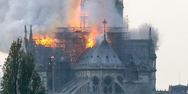 Flames rise during a fire at the landmark Notre-Dame Cathedral in central Paris on April 15, 2019 afternoon.