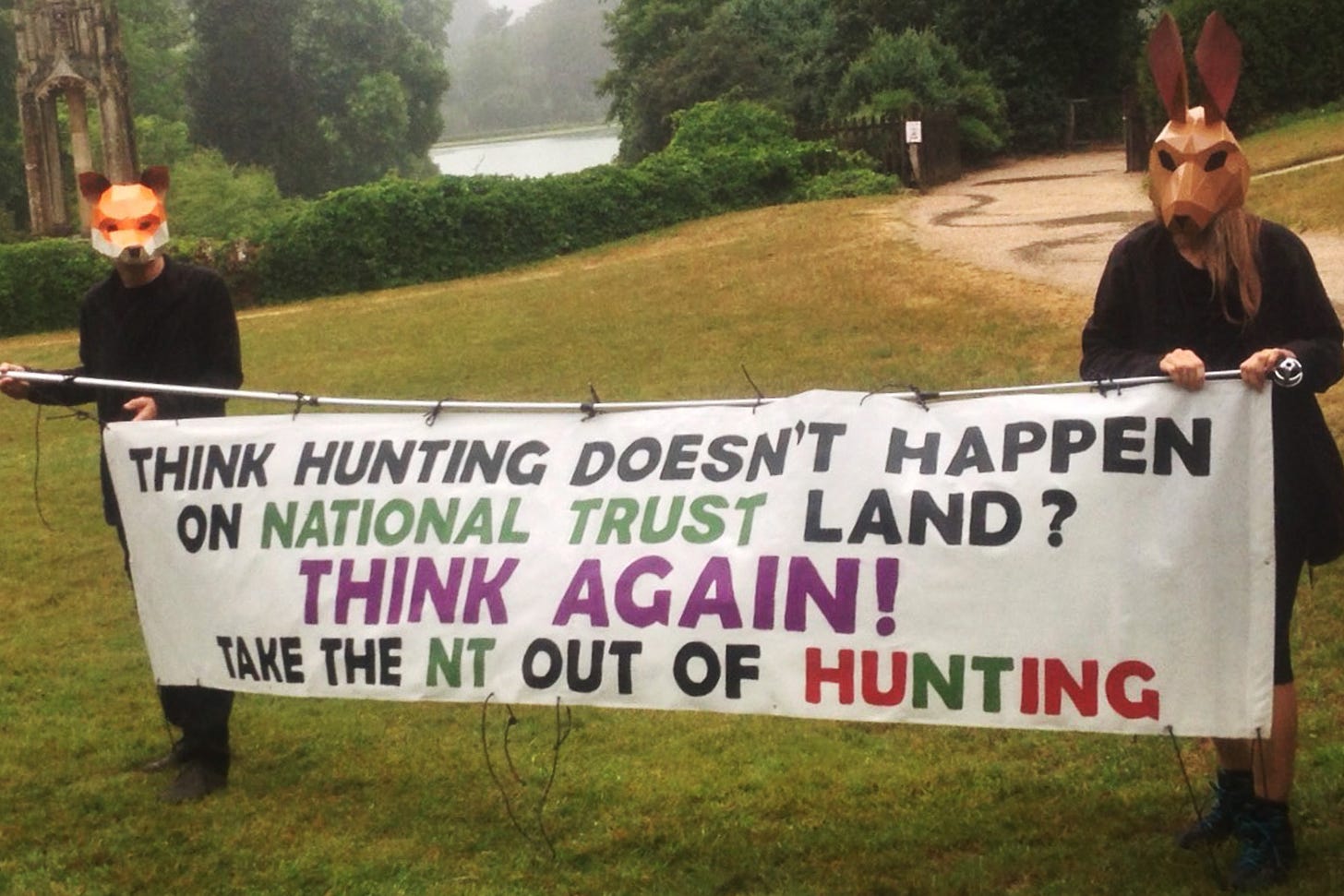 Protesters hold banner saying "Take the NT out of hunting".