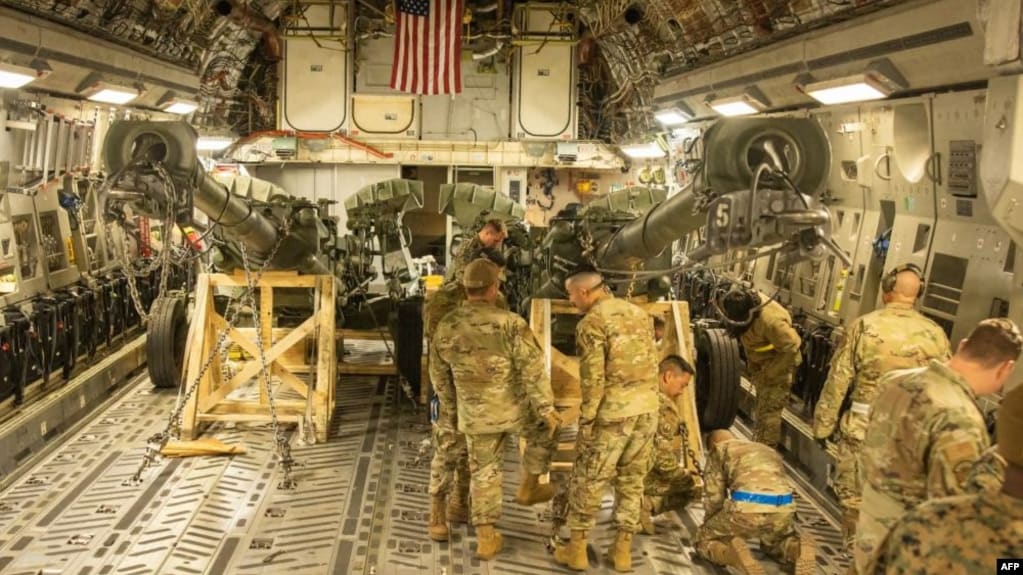 FILE - This handout photo courtesy of the U.S. Marine Corps obtained on April 27, 2022, shows U.S. Marines load an M777 towed 155 mm howitzer into the cargo hold of a U.S. Air Force C-17 Globemaster III at March Air Reserve Base, California, April 21, 2022.