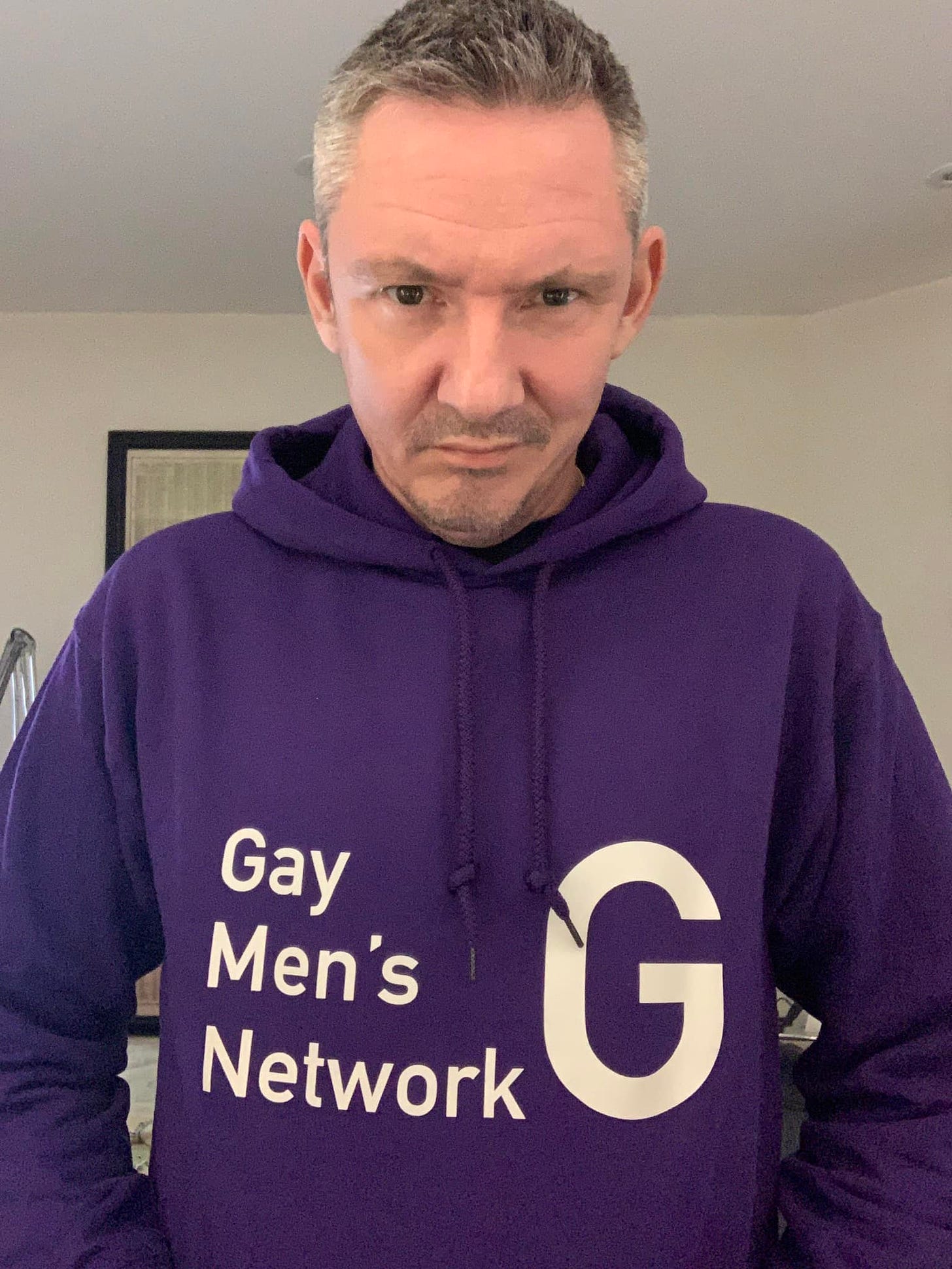 May be an image of 1 person, beard and text that says 'Gay Men's Network G'