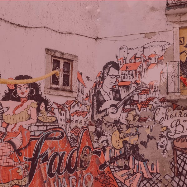 Wall painted mural on with words Fado and musicians in Portugal.